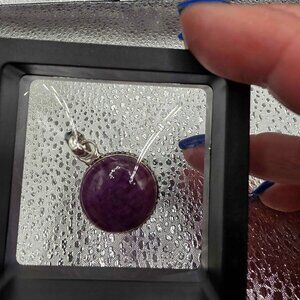 Sterling Silver (.925) and Amethyst stone.